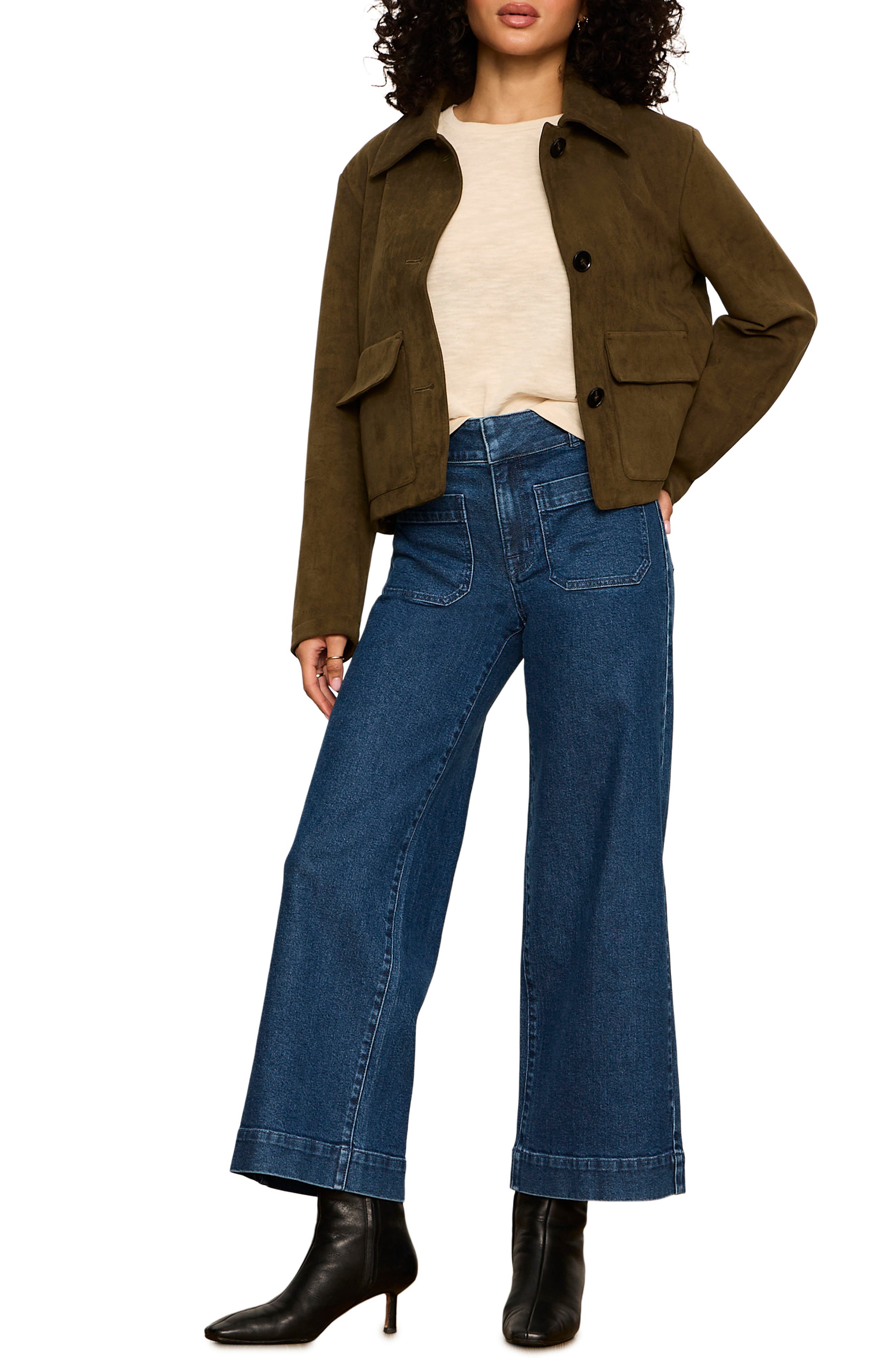 Model wearing Sanctuary Avid Suede Jacket in Light Kalamata olive green with wide-leg jeans