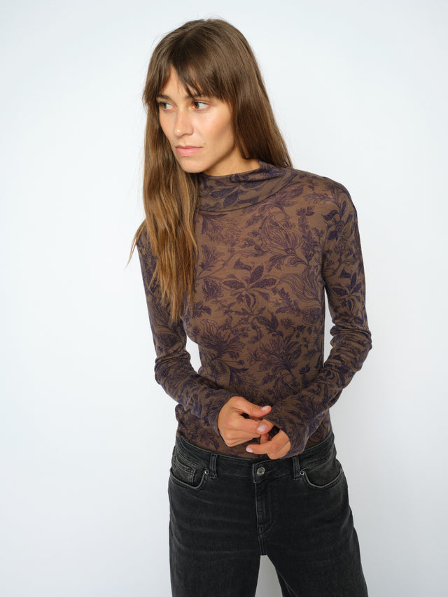 Brown floral print long-sleeve turtleneck top with dark purple botanical pattern