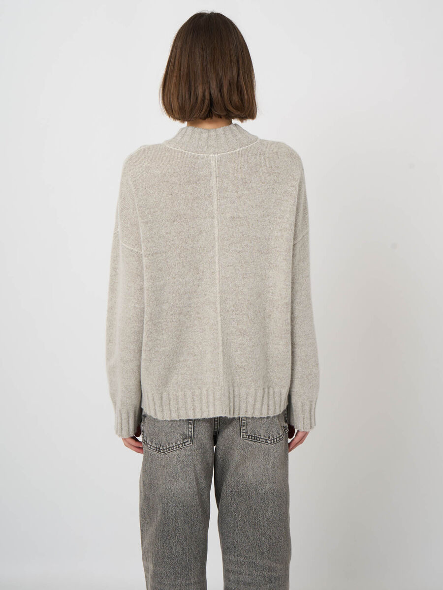 Oversized light grey wool cashmere pullover sweater with mock neck, back view