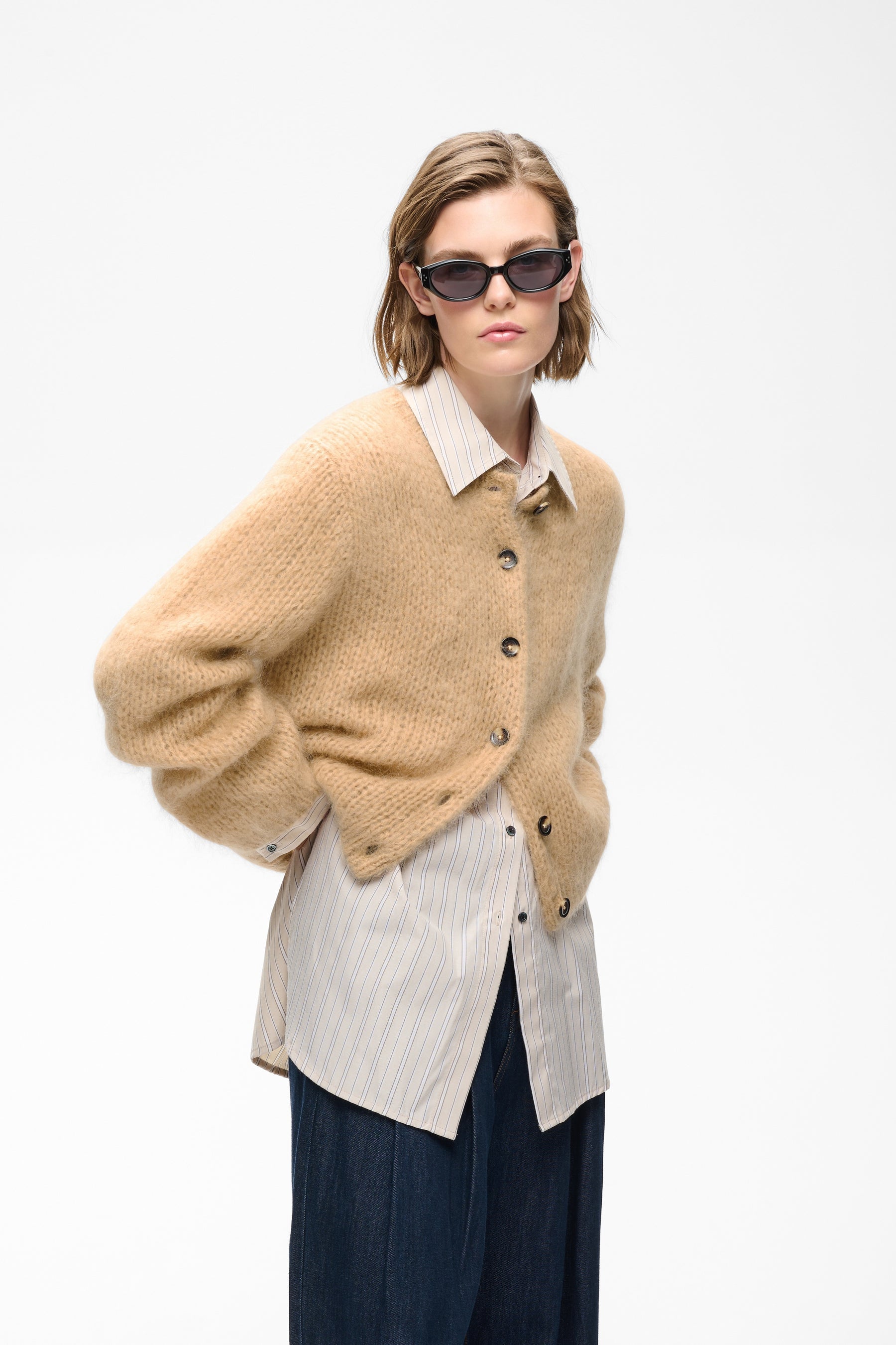 Oversized camel fuzzy knit cardigan with button front closure and ribbed texture