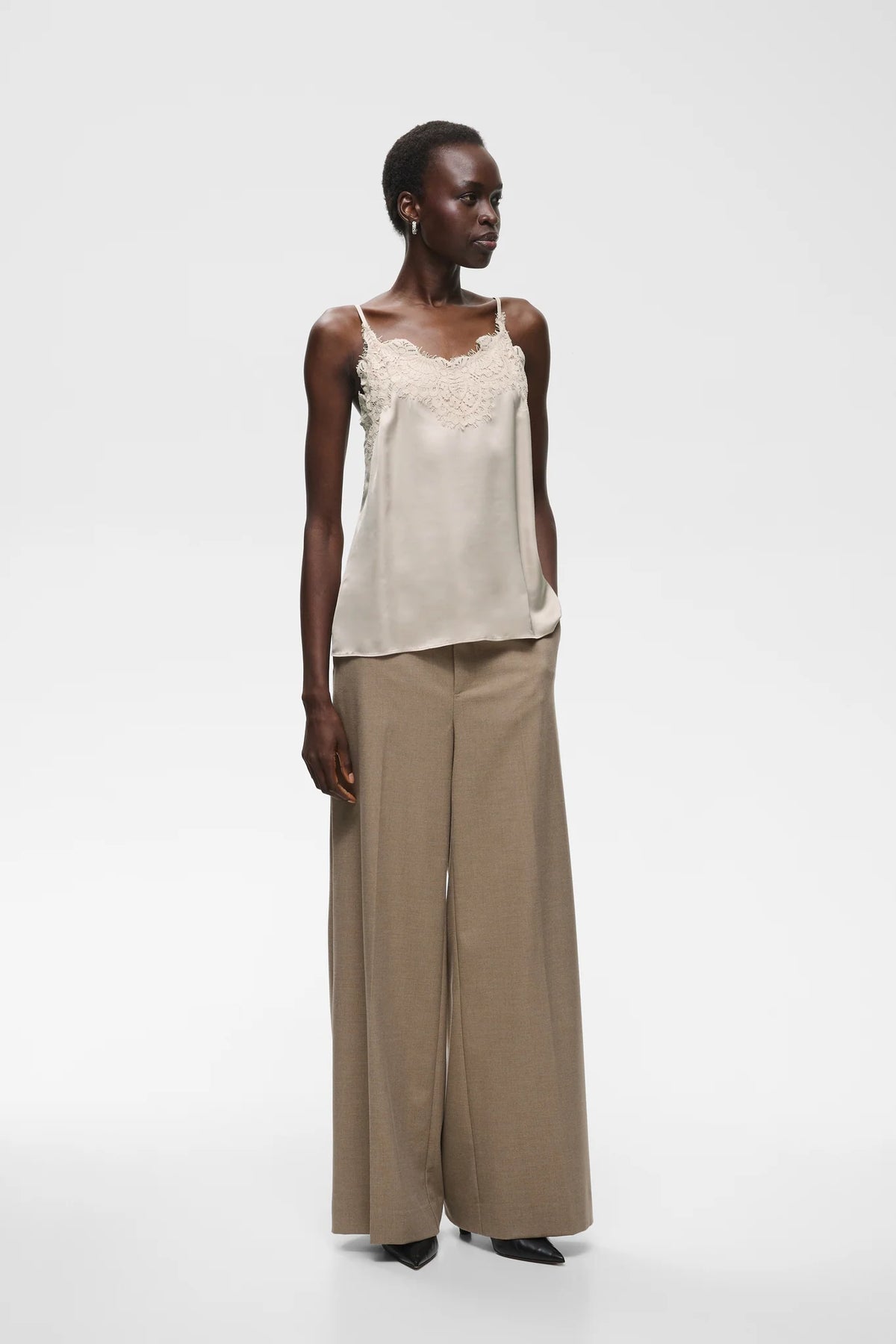 Ivory satin camisole with lace trim neckline and thin shoulder straps