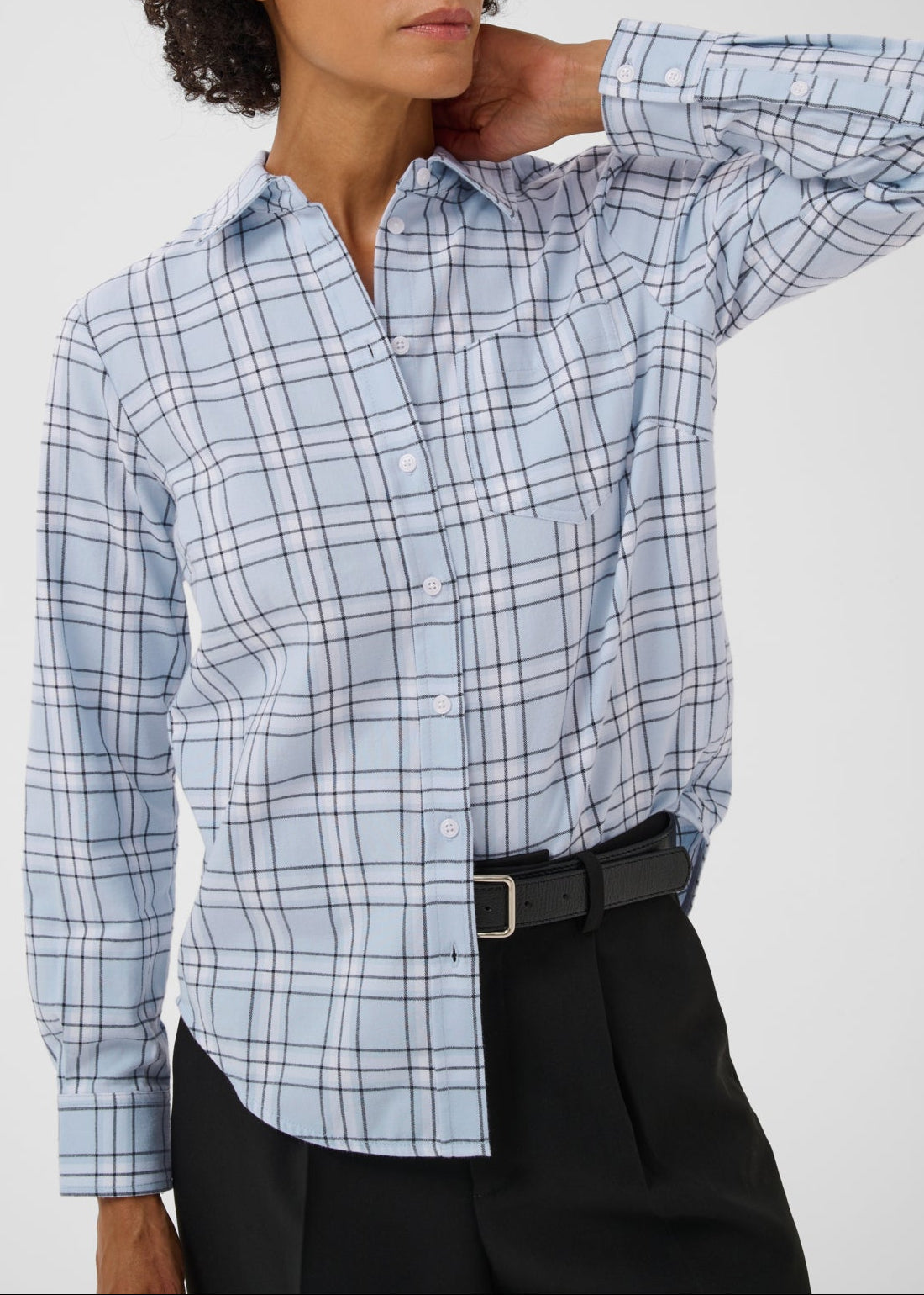Model wearing Part Two Yana Shirt in heather check light blue plaid with black trousers