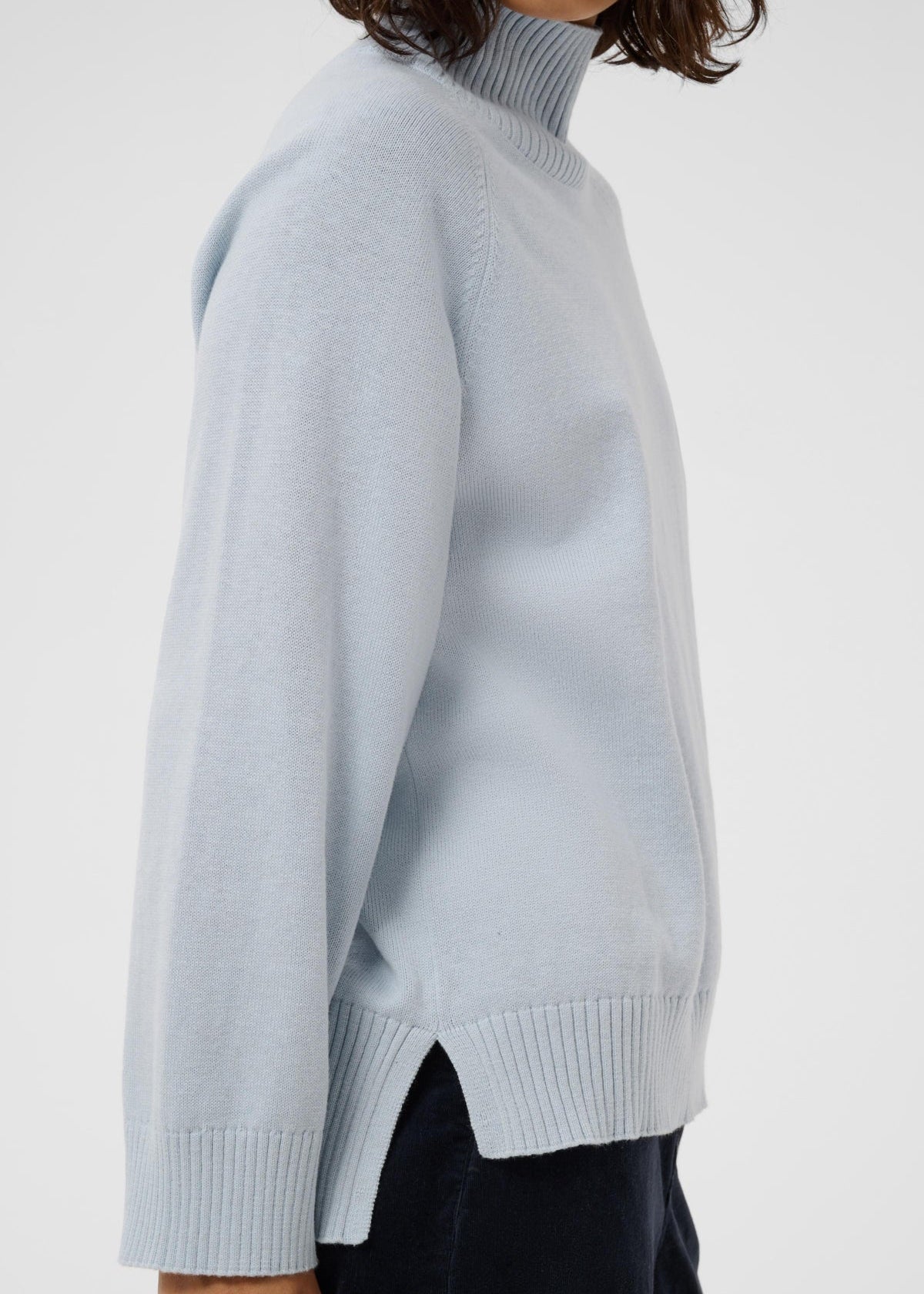 Side view of Part Two Chicky Pullover turtleneck sweater in light gray-dawn blue knit