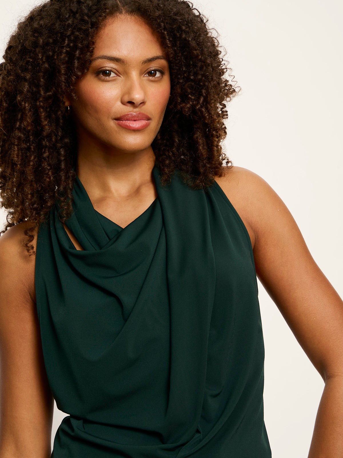 Model wearing Sanctuary Nora Draped Tank in forest green with cowl neckline detail