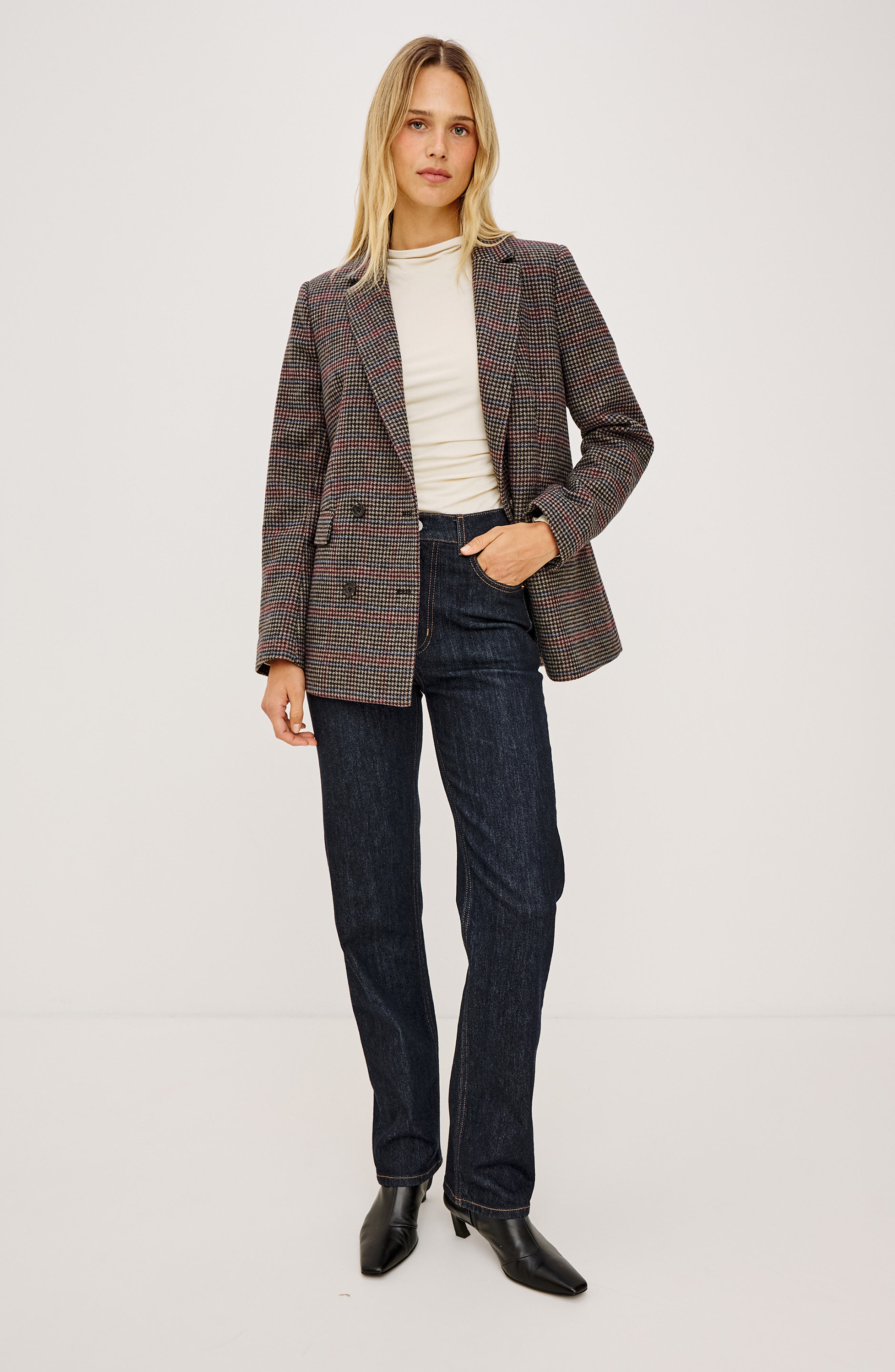 Model wearing Rails JAC double-breasted blazer in Oxford Plum houndstooth check with dark jeans