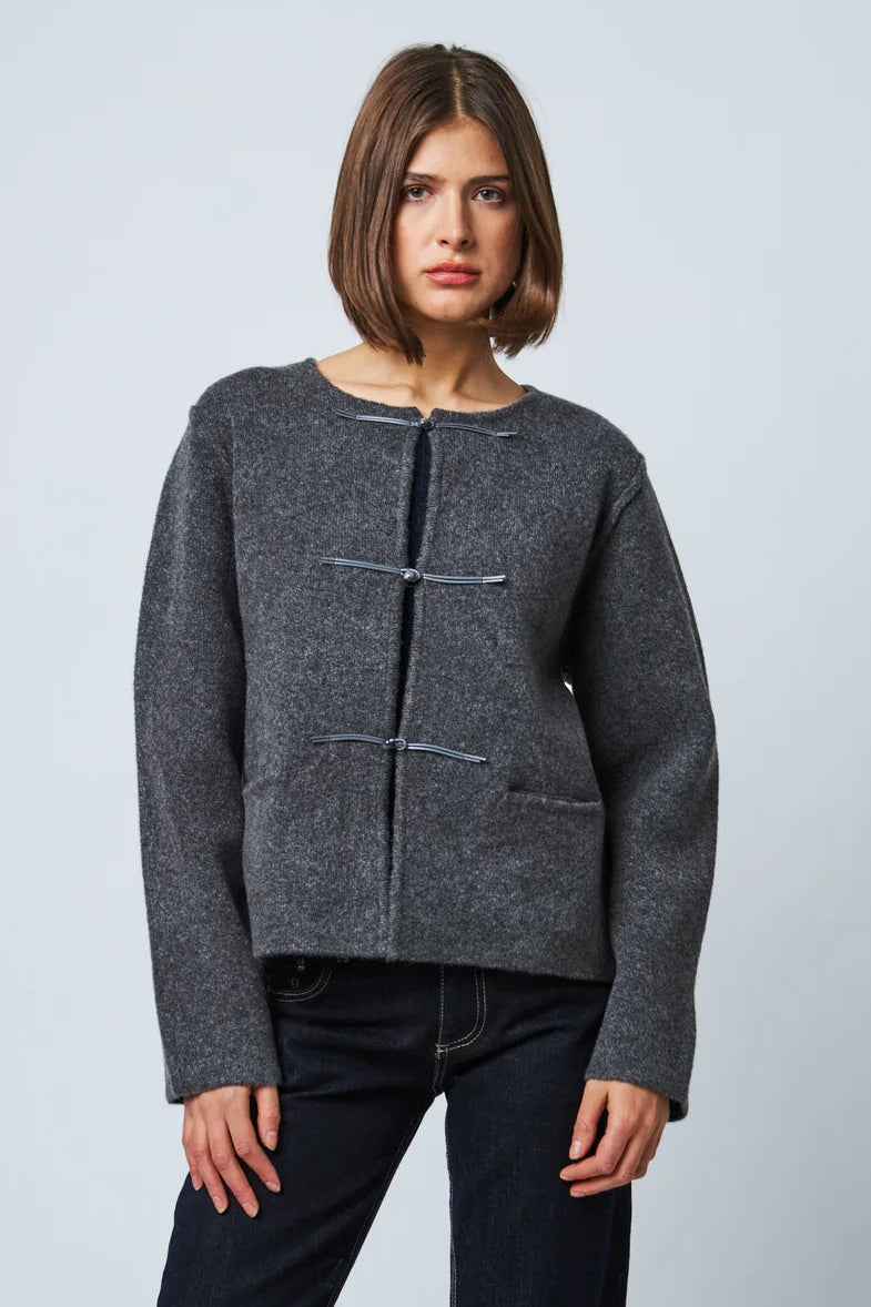 Dark gray wool cardigan with toggle closures and front pocket on female model