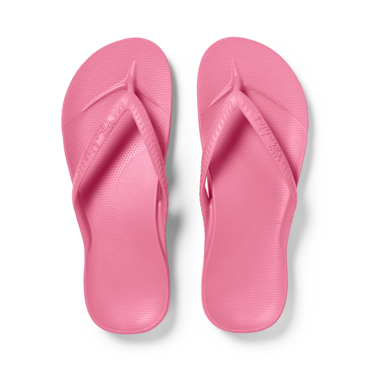 Archies Hot Pink arch support flip flops shown from above on white background