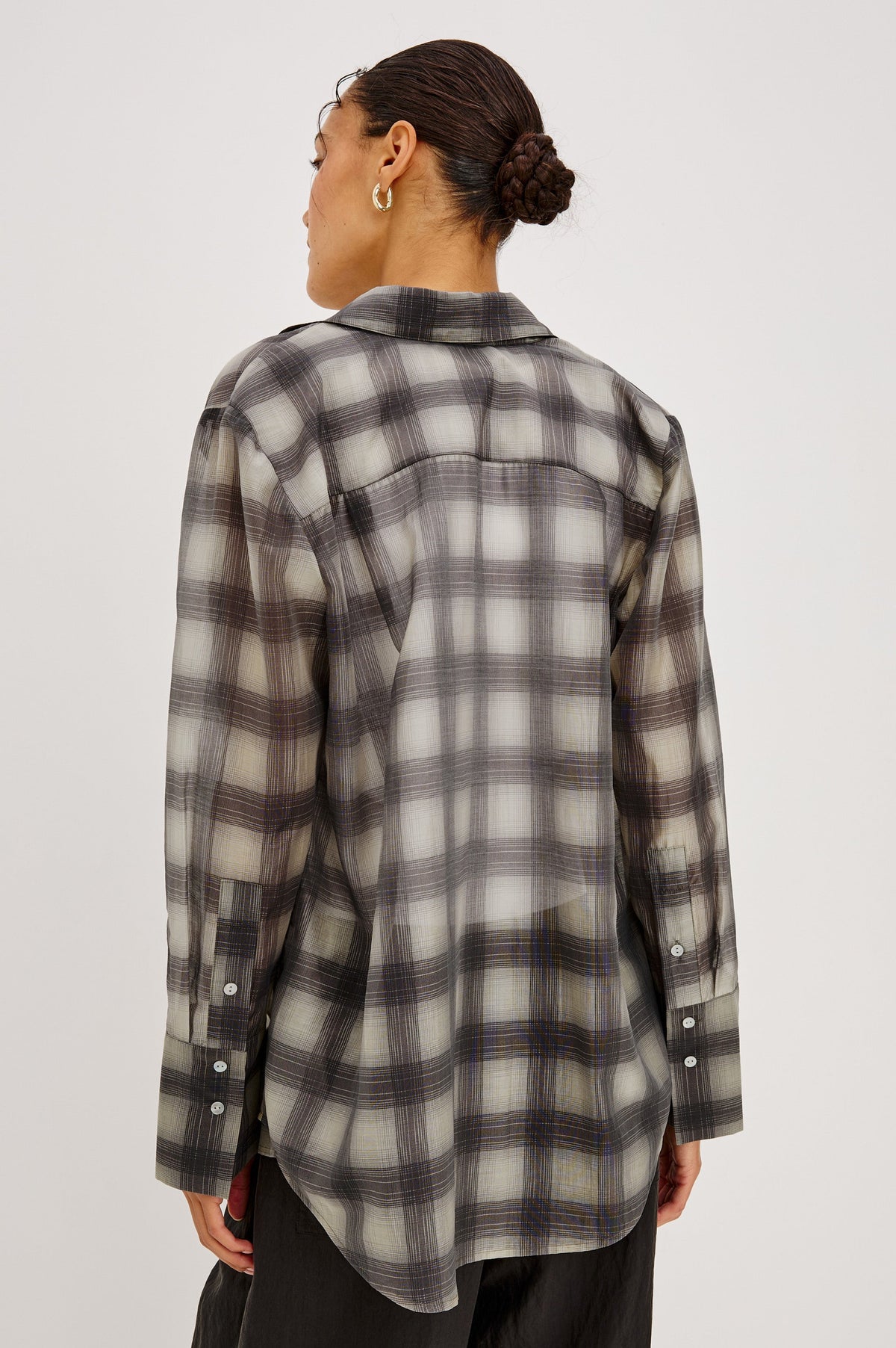 Back view of Rails Bishop shirt in onyx-taupe plaid flannel with long sleeves on model