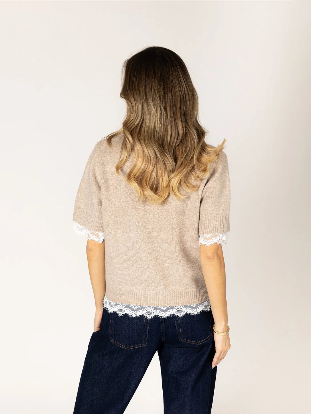 Lyla & Luxe Ava beige short-sleeve knit sweater with white lace hem trim
