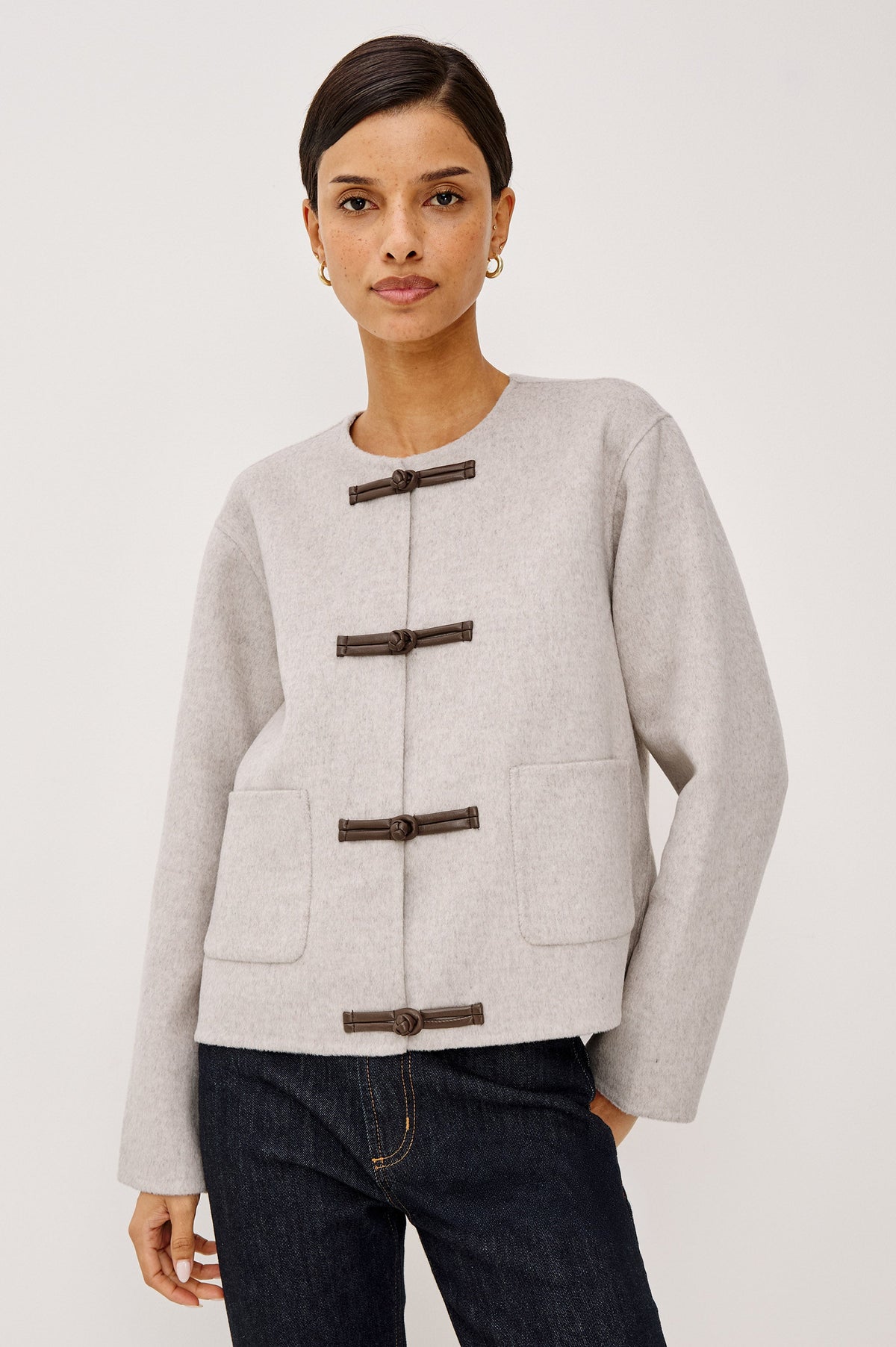 Woman wearing Rails Deidre jacket in heather oat with toggle closures and patch pockets