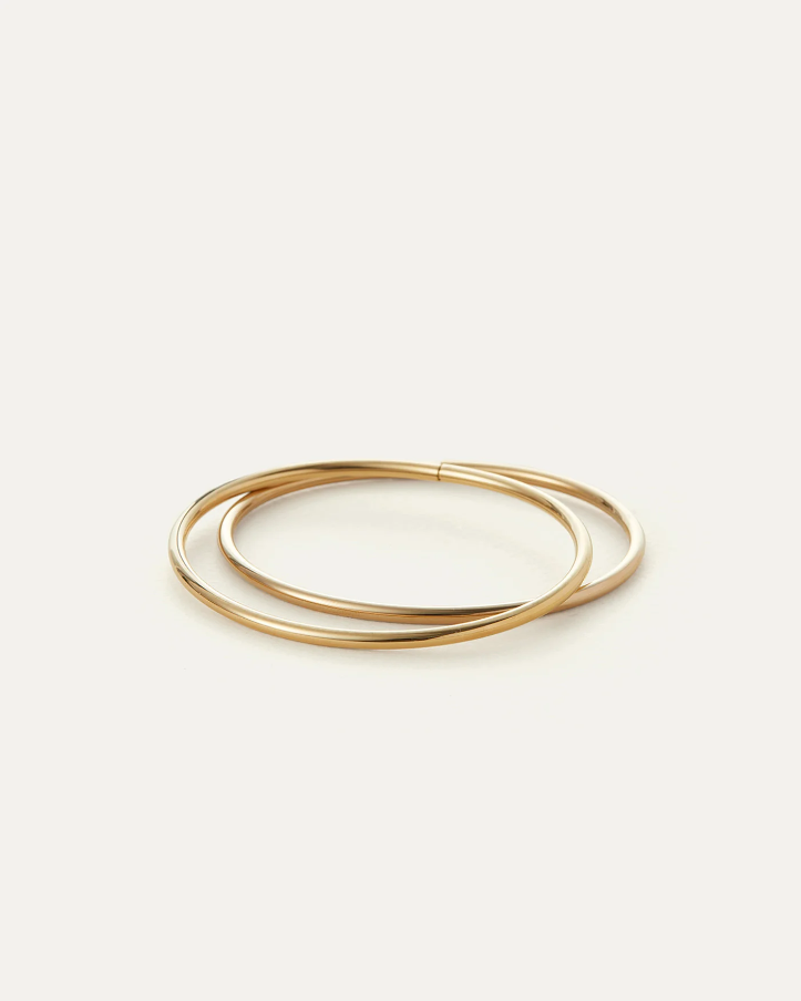 Jenny Bird Dane Bangle Set of two slim polished gold bangles on white background