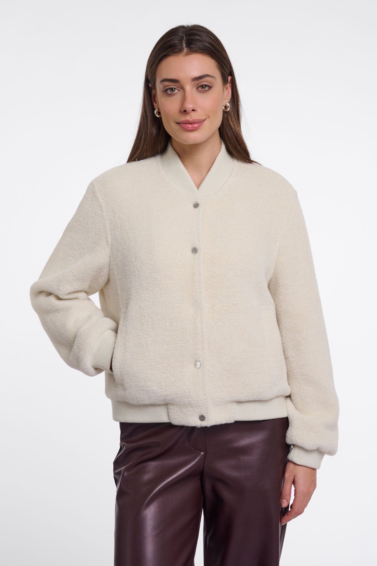 Woman wearing RINO & PELLE Felix cream bouclé bomber jacket with snap buttons and ribbed trim