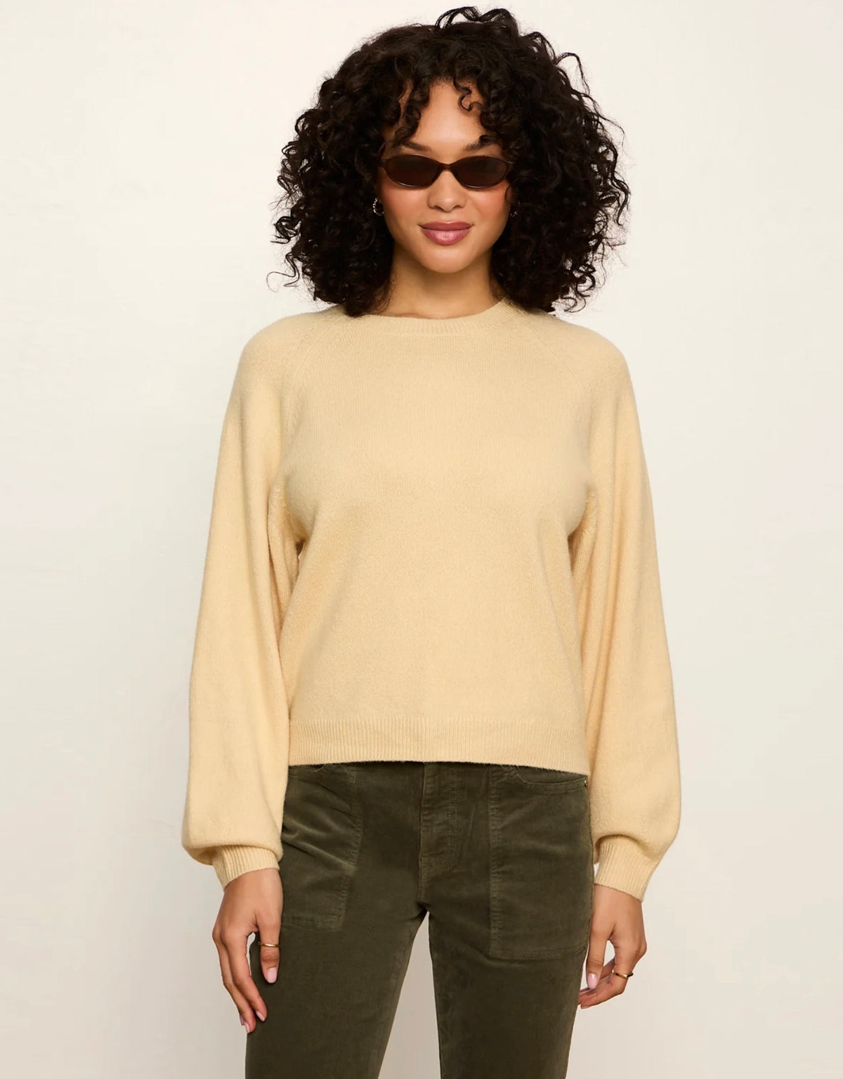 Sanctuary soft cream crewneck sweater with balloon sleeves, worn with olive pants