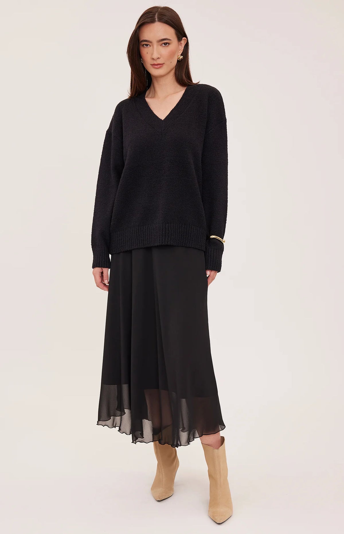 Gentle Fawn Arianna black V-neck oversized knit sweater worn with midi skirt
