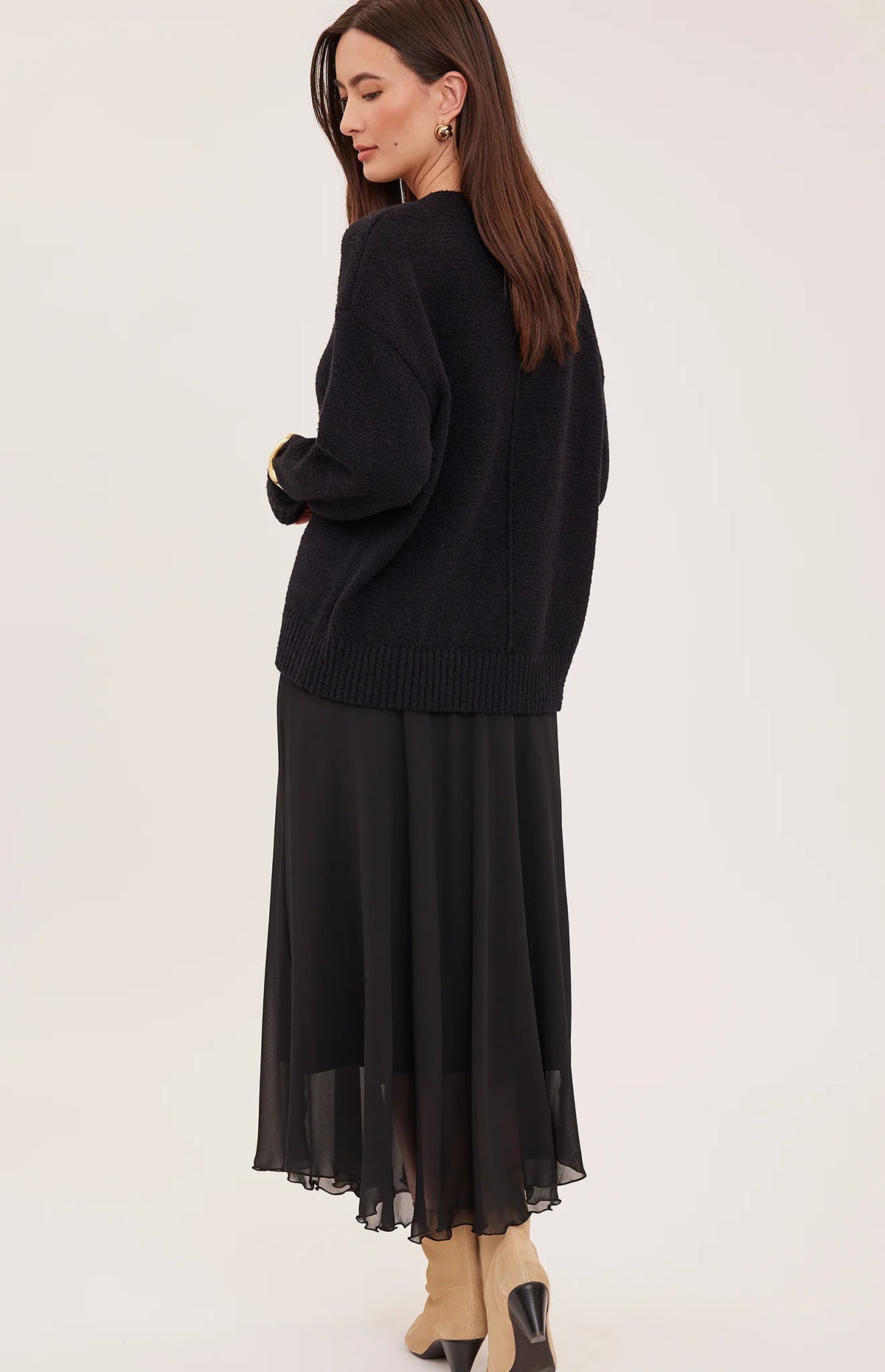 Gentle Fawn Arianna black oversized knit sweater, worn with black chiffon midi skirt