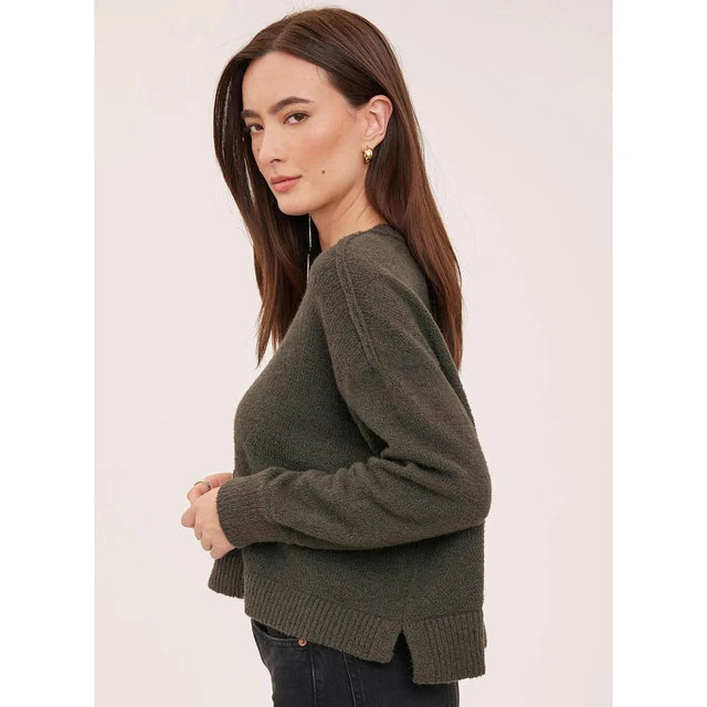 Olive green knit crewneck sweater with ribbed hem and side slits