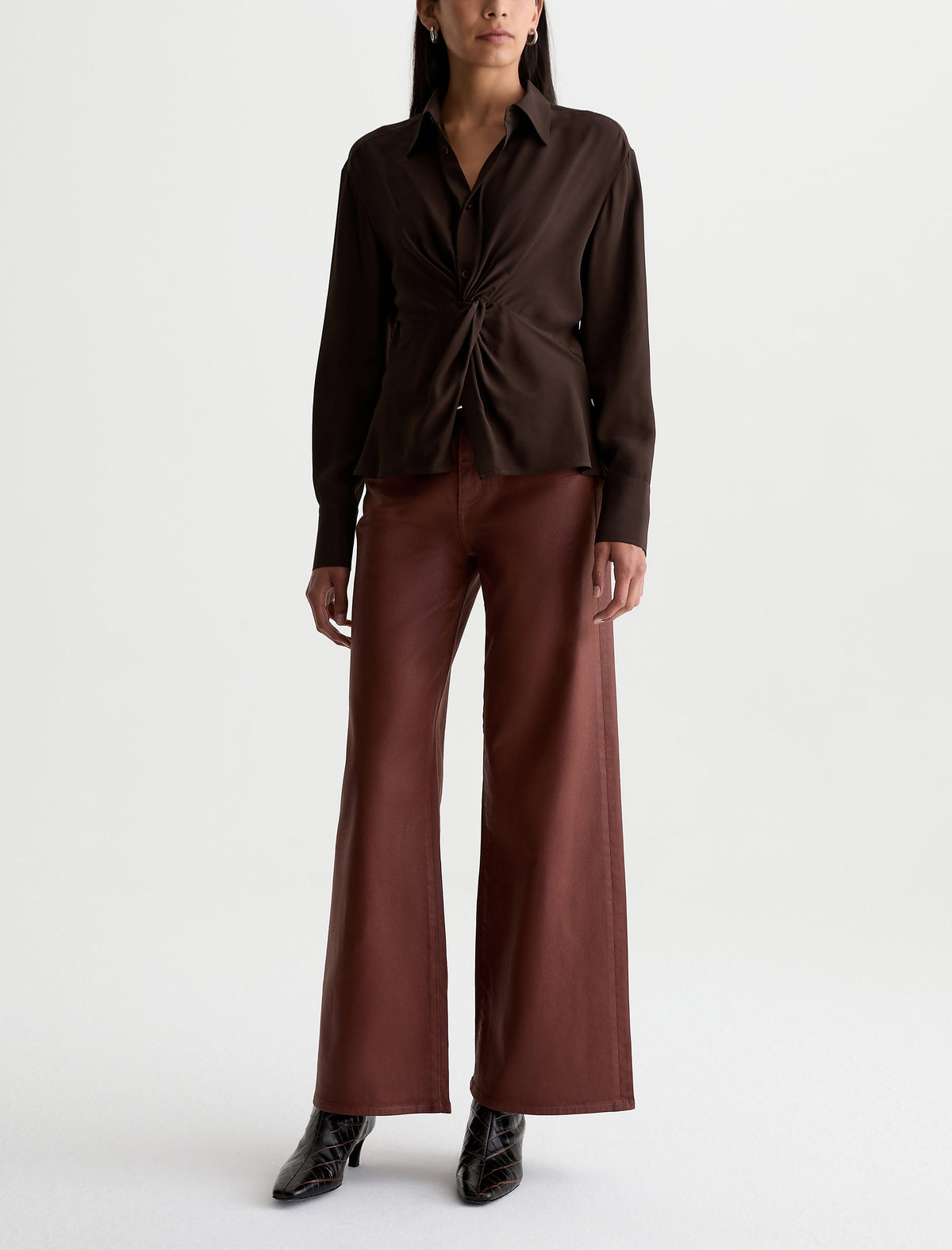 Model wearing AG Saige Wide Leg pants in LT Chestnut with dark brown blouse and black boots