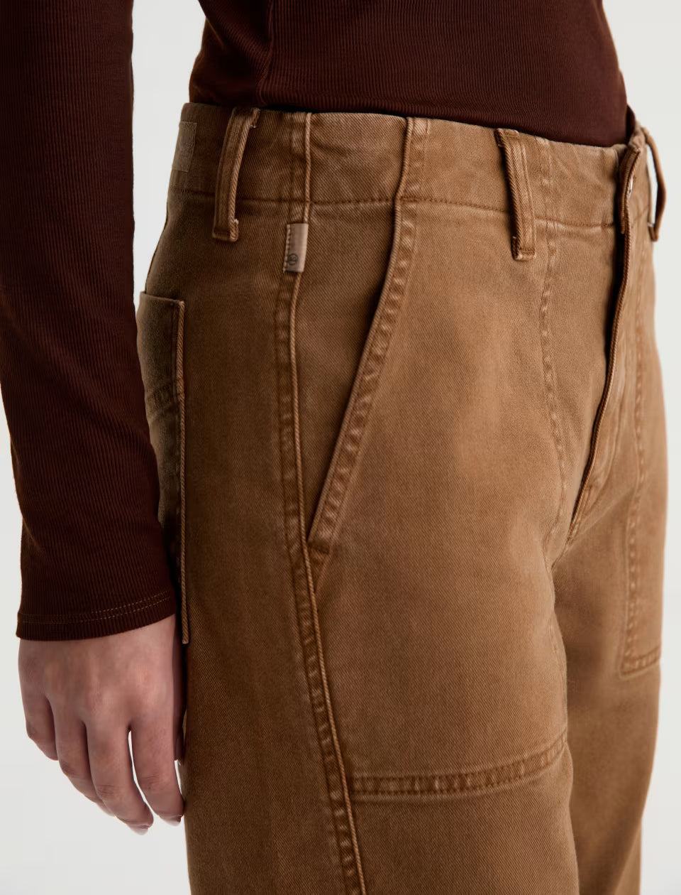 AG Analeigh tan cargo pants with utility pockets and belt loops, close-up view