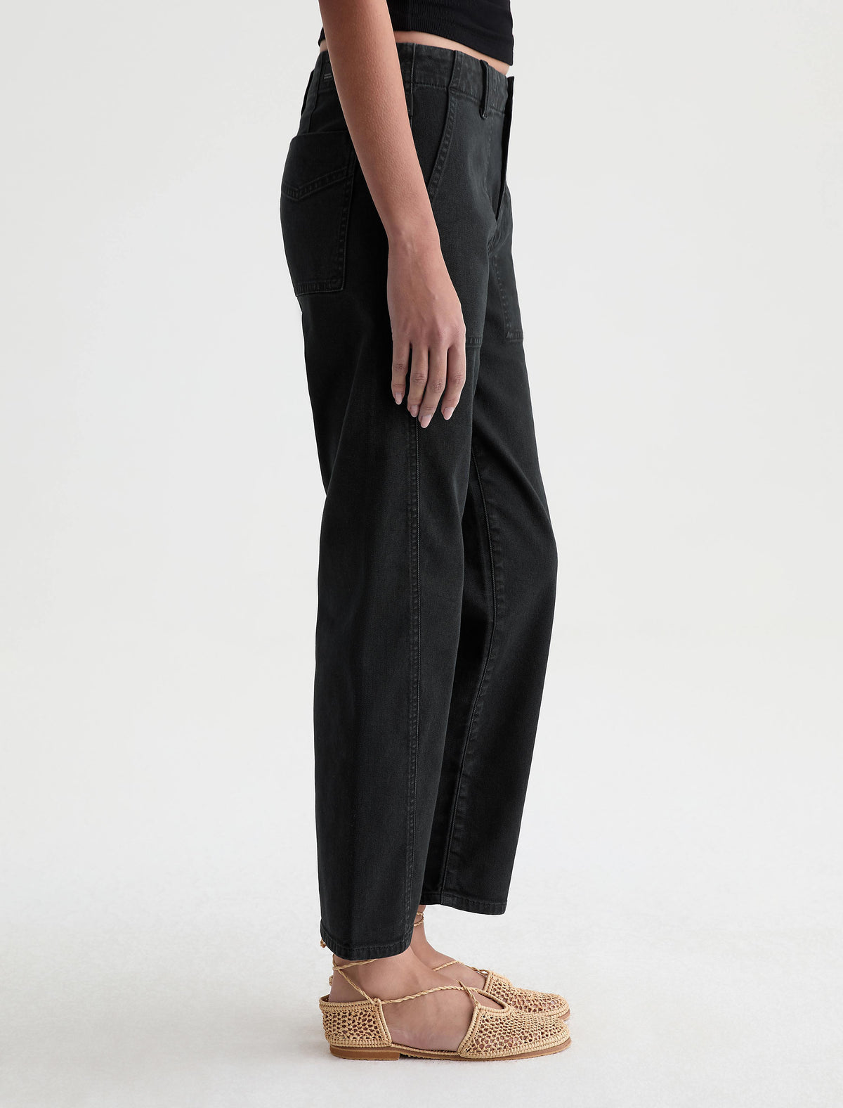 Side view of AG Analeigh cropped wide-leg jeans in sulfur super black on model