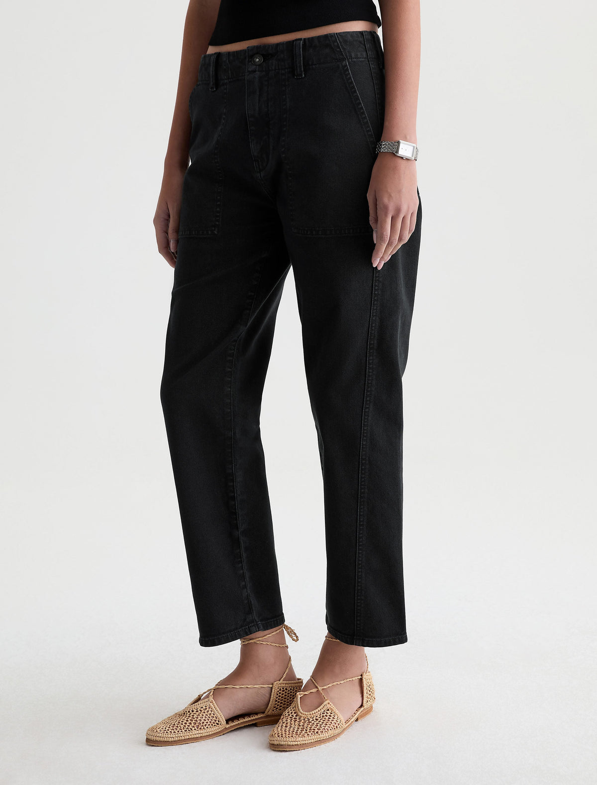 AG Analeigh Sulfur Super Black cropped utility pants styled with woven flat shoes on model