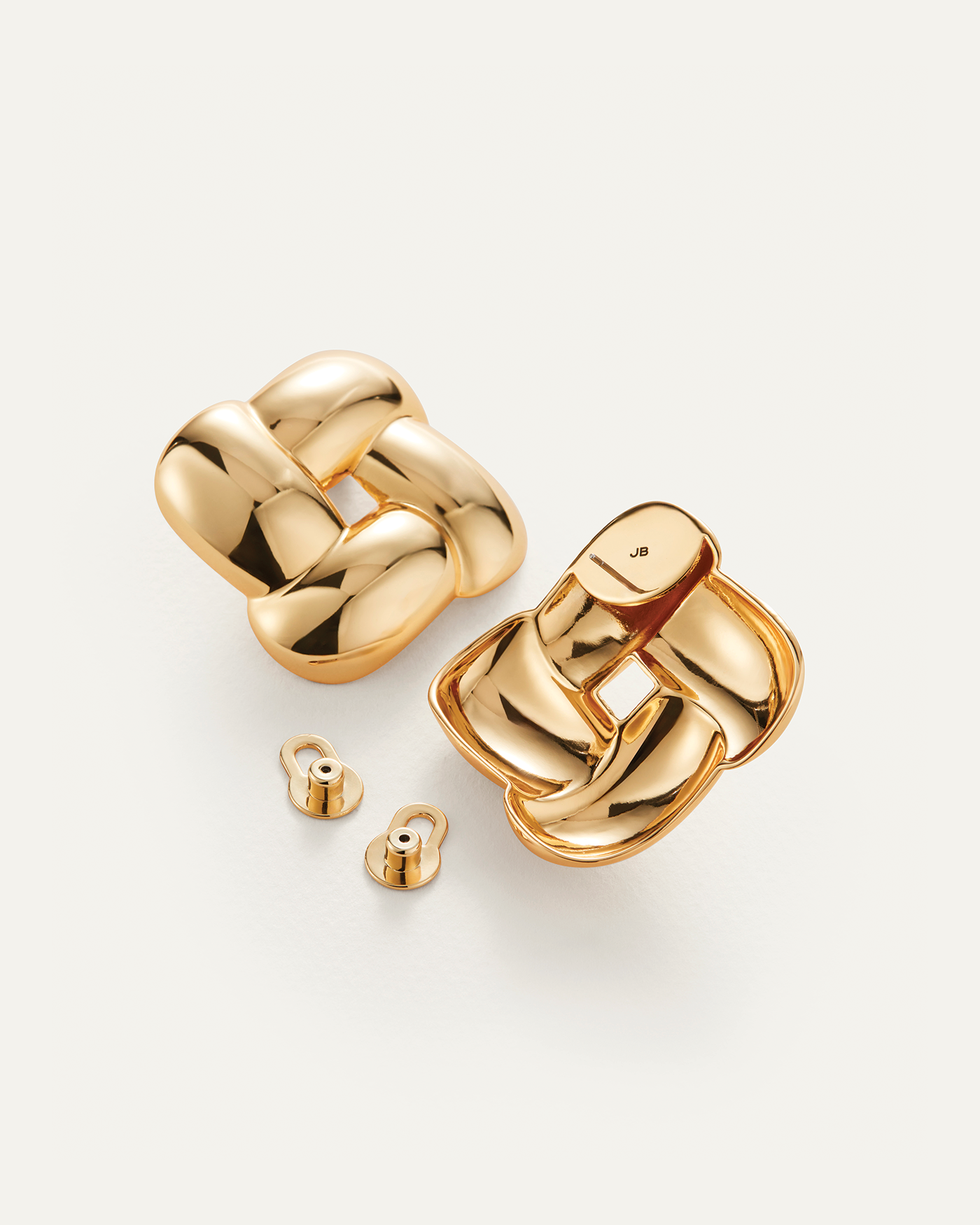 Jenny Bird Gio gold chunky braided knot stud earrings shown front and back with earring backs