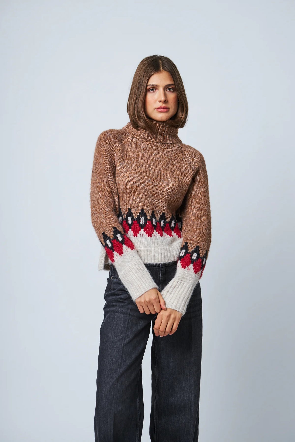 Brown Fair Isle turtleneck sweater with red and black geometric pattern and cream hem
