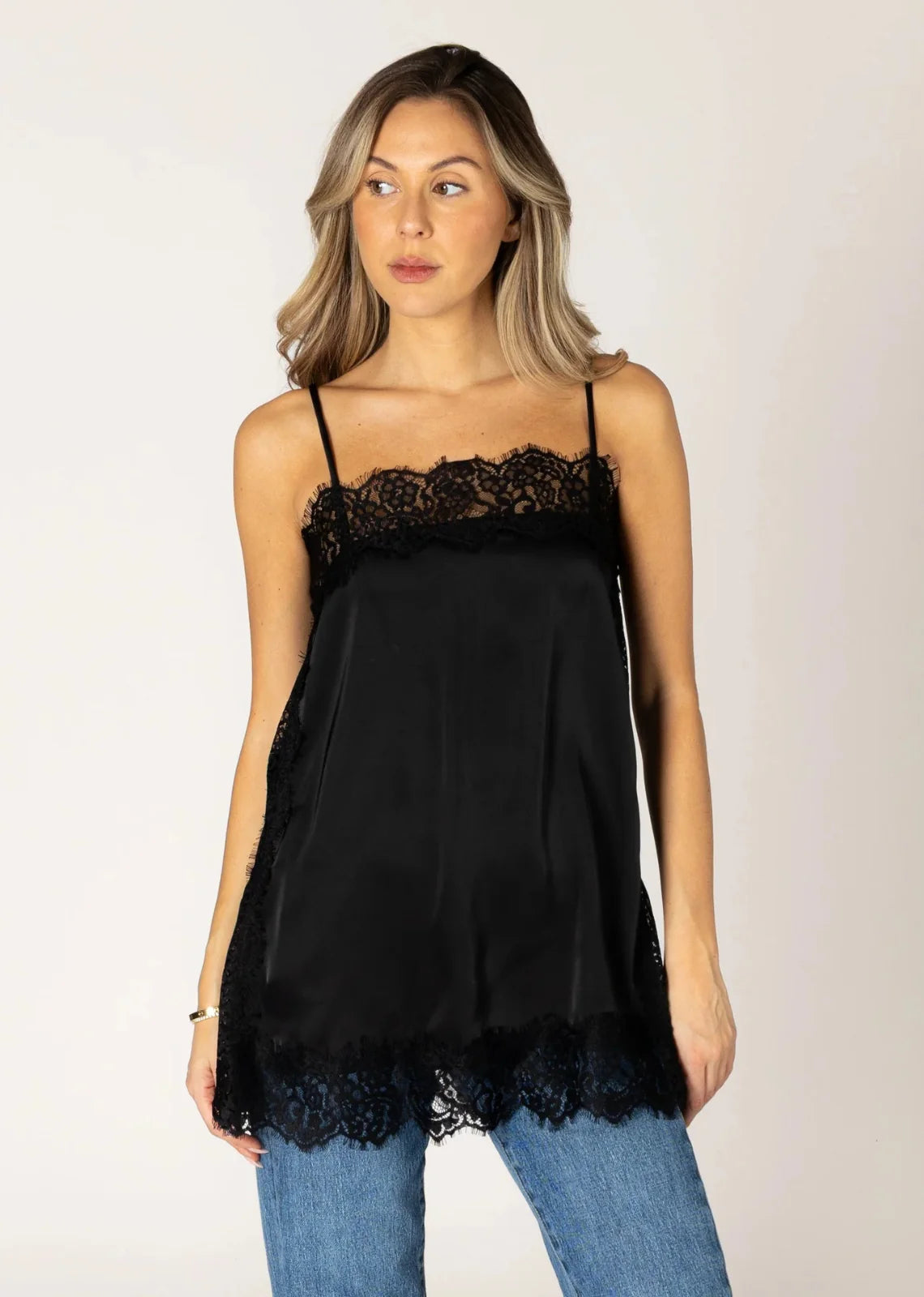 Black satin cami top with lace trim neckline, sides, and hem