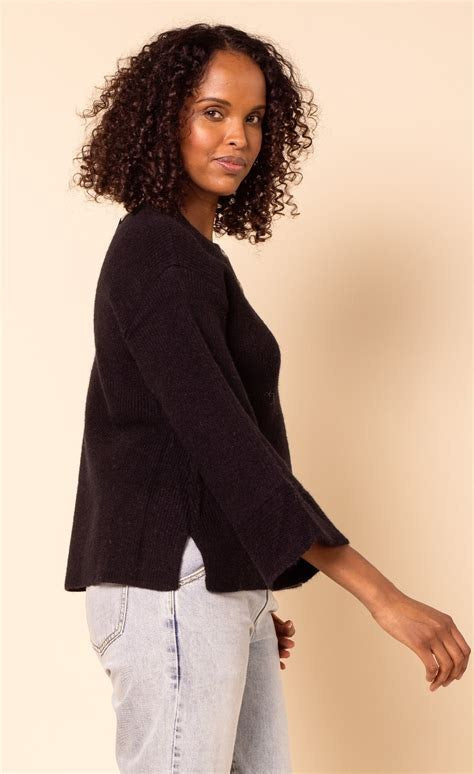 Gentle Fawn Anouk black knit sweater with 3/4 sleeves, worn with light jeans