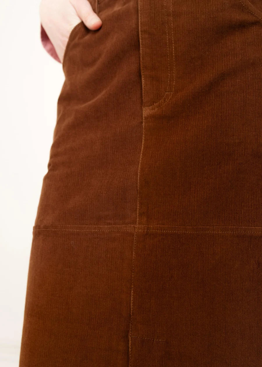 Brown corduroy midi skirt with side pocket and panel seam detailing