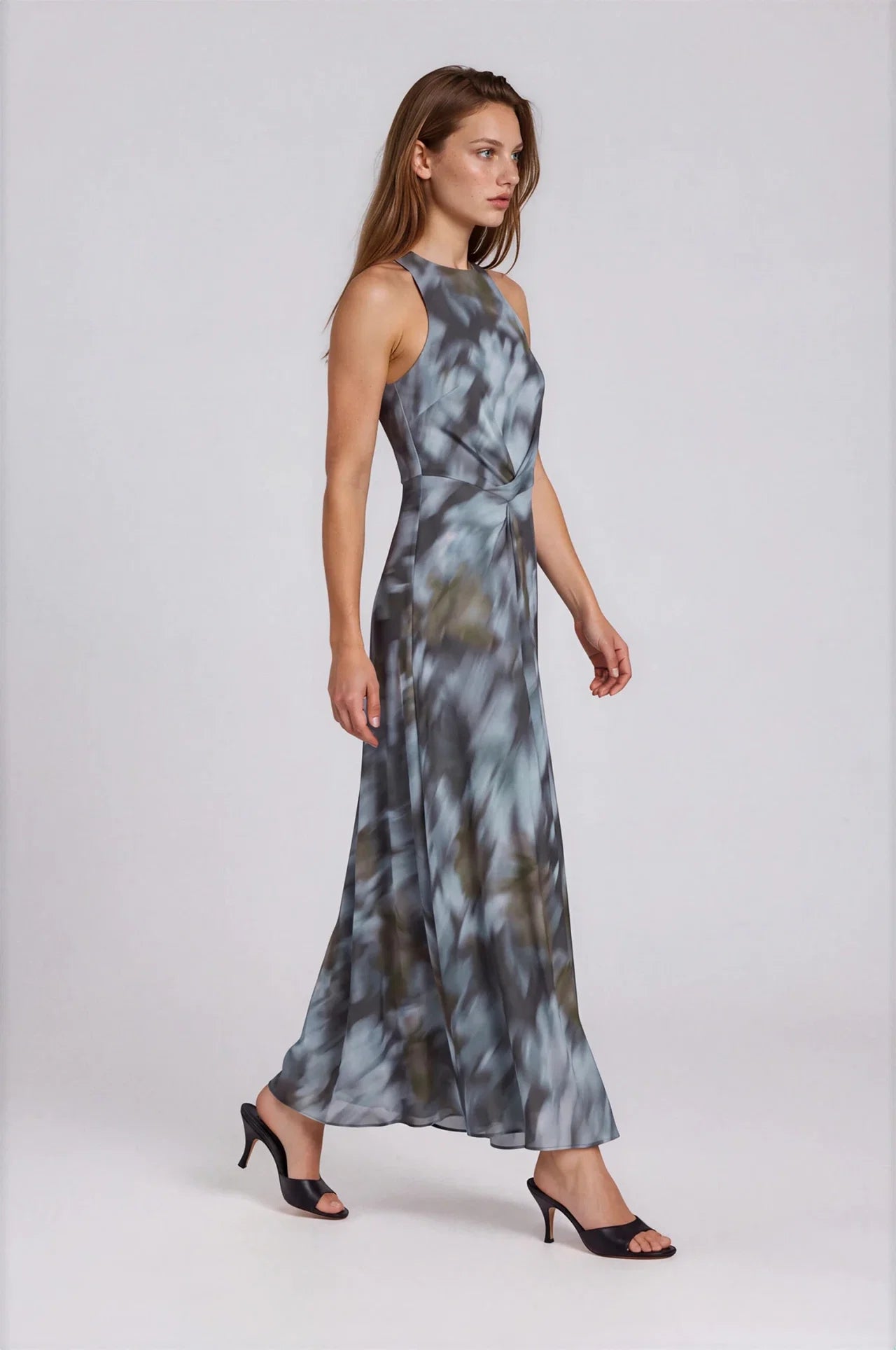 Sleeveless maxi dress in blue-grey abstract floral print with twist waist detail