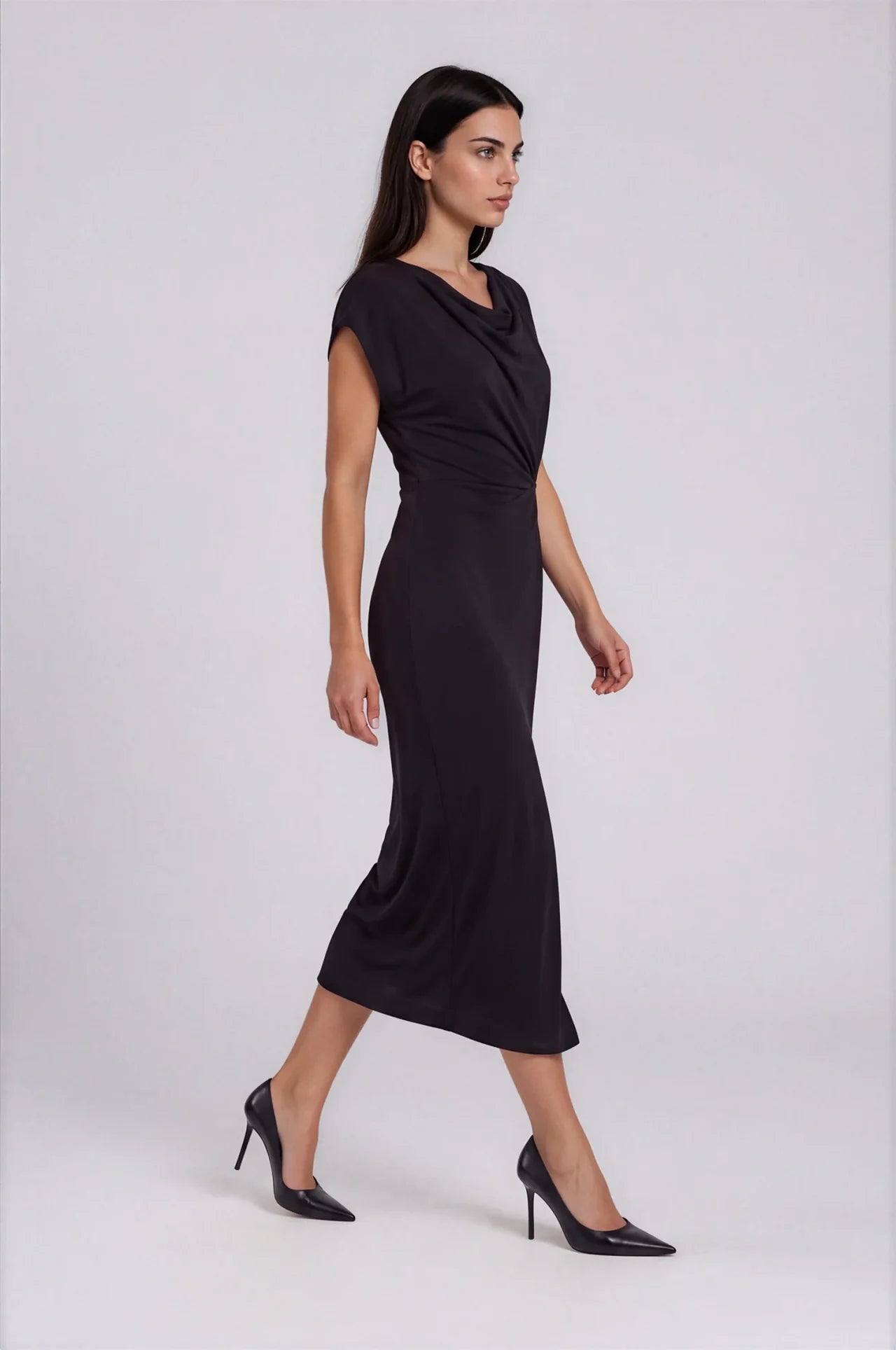 Black midi wrap dress with cowl neck and cap sleeves, styled with black heels