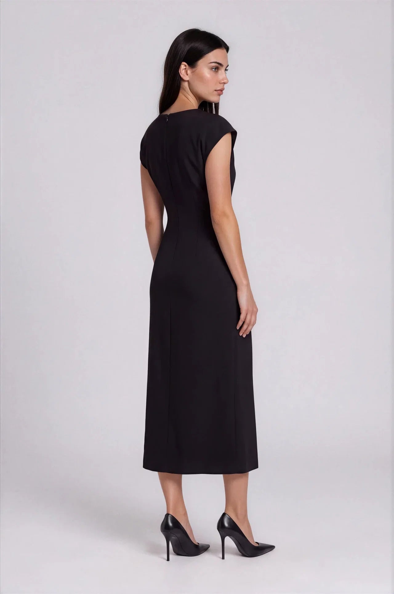 Black midi cap-sleeve fitted dress with back zipper, shown with black heels