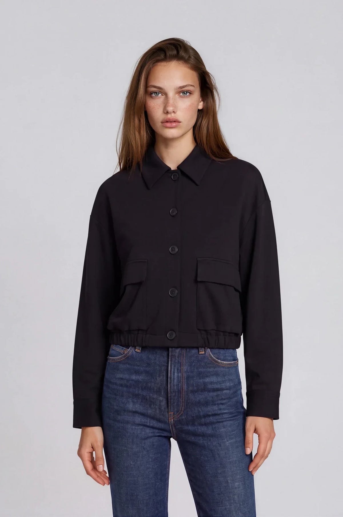 Black scuba bomber jacket with button front, collar, and flap pockets