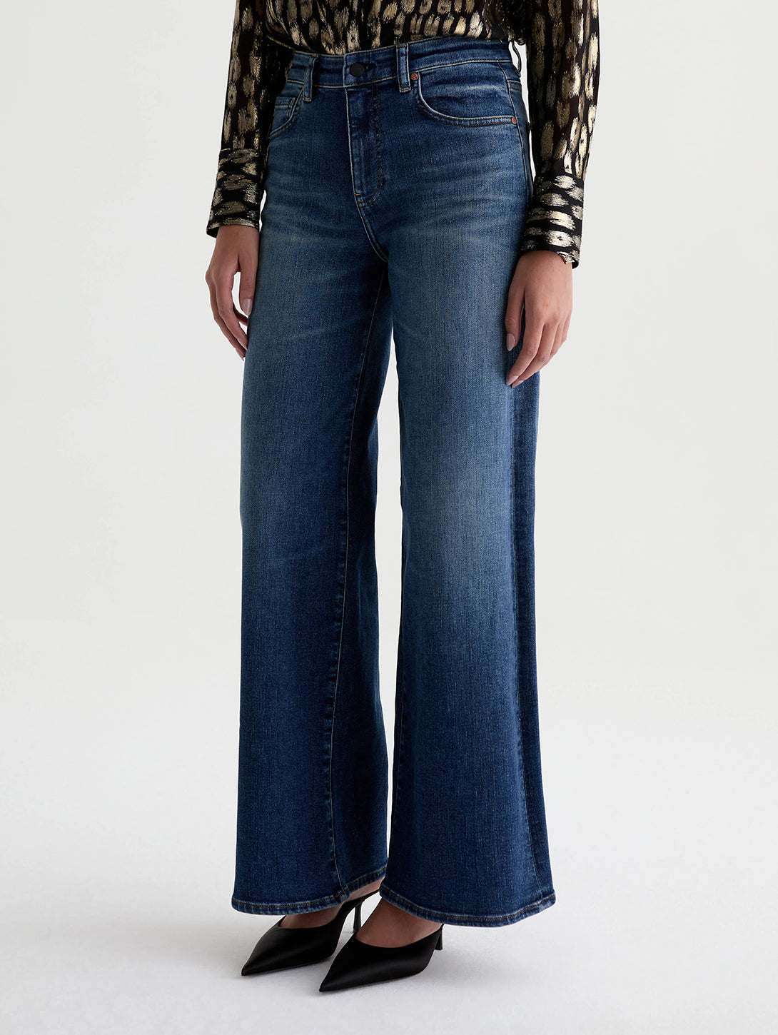 AG Saige wide leg jeans in 14 Years Bluegrass dark indigo wash, styled with black heels