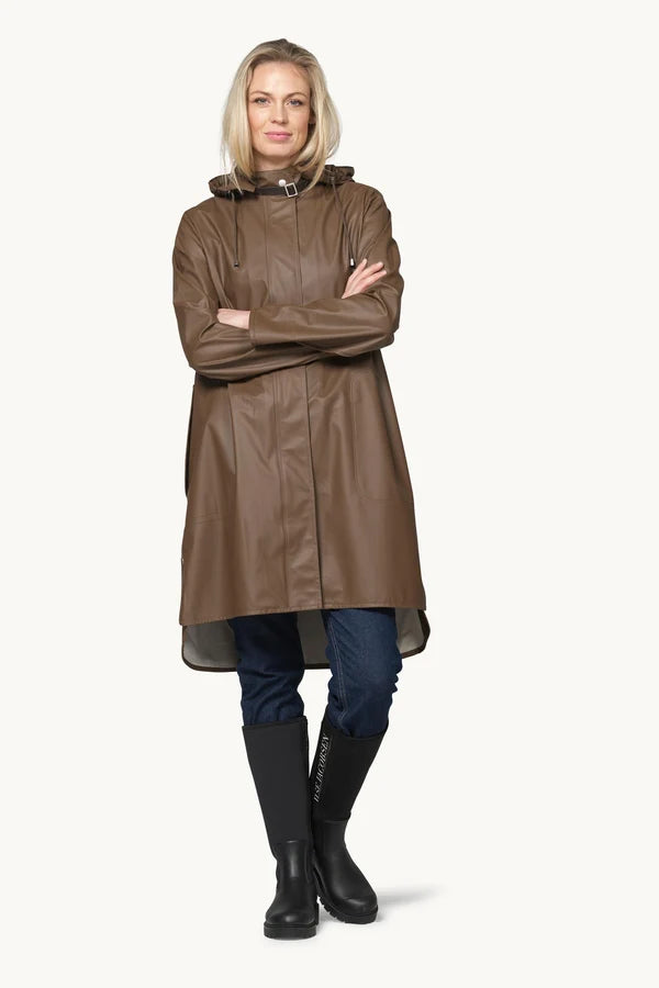 Ilse Jacobsen RAIN71 brown hooded raincoat worn with dark jeans and black rubber boots