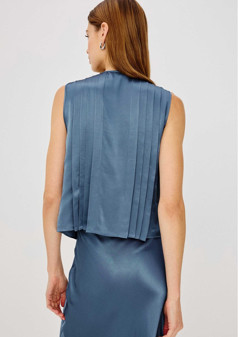 Back view of Rails AJA sleeveless pleated satin top in Atlantic blue worn by model