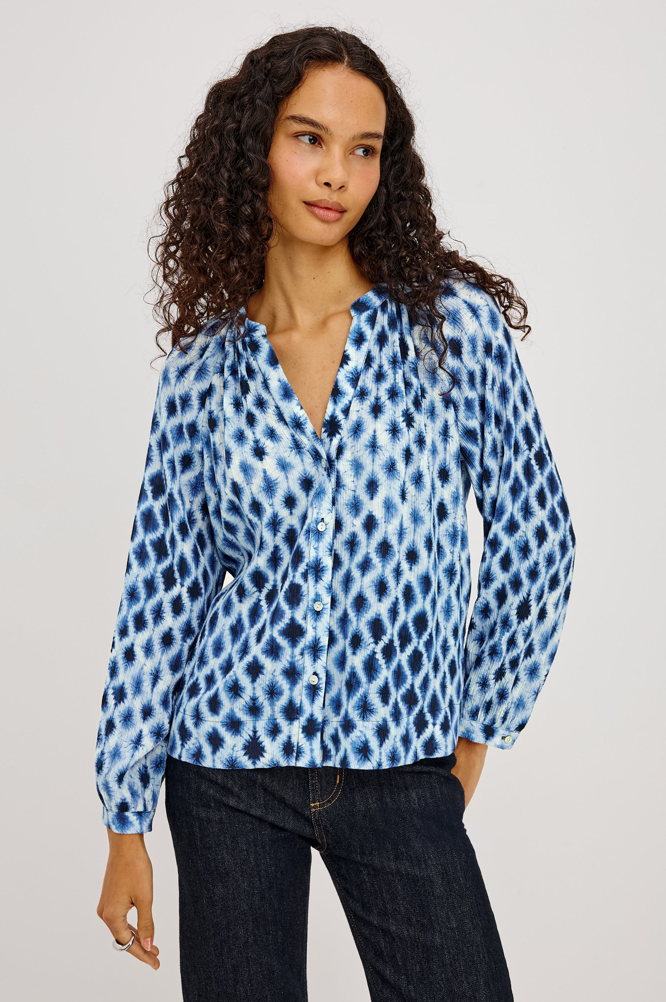 Model wearing Rails Saint blouse in Sapphire Shibori blue tie-dye diamond print with long sleeves