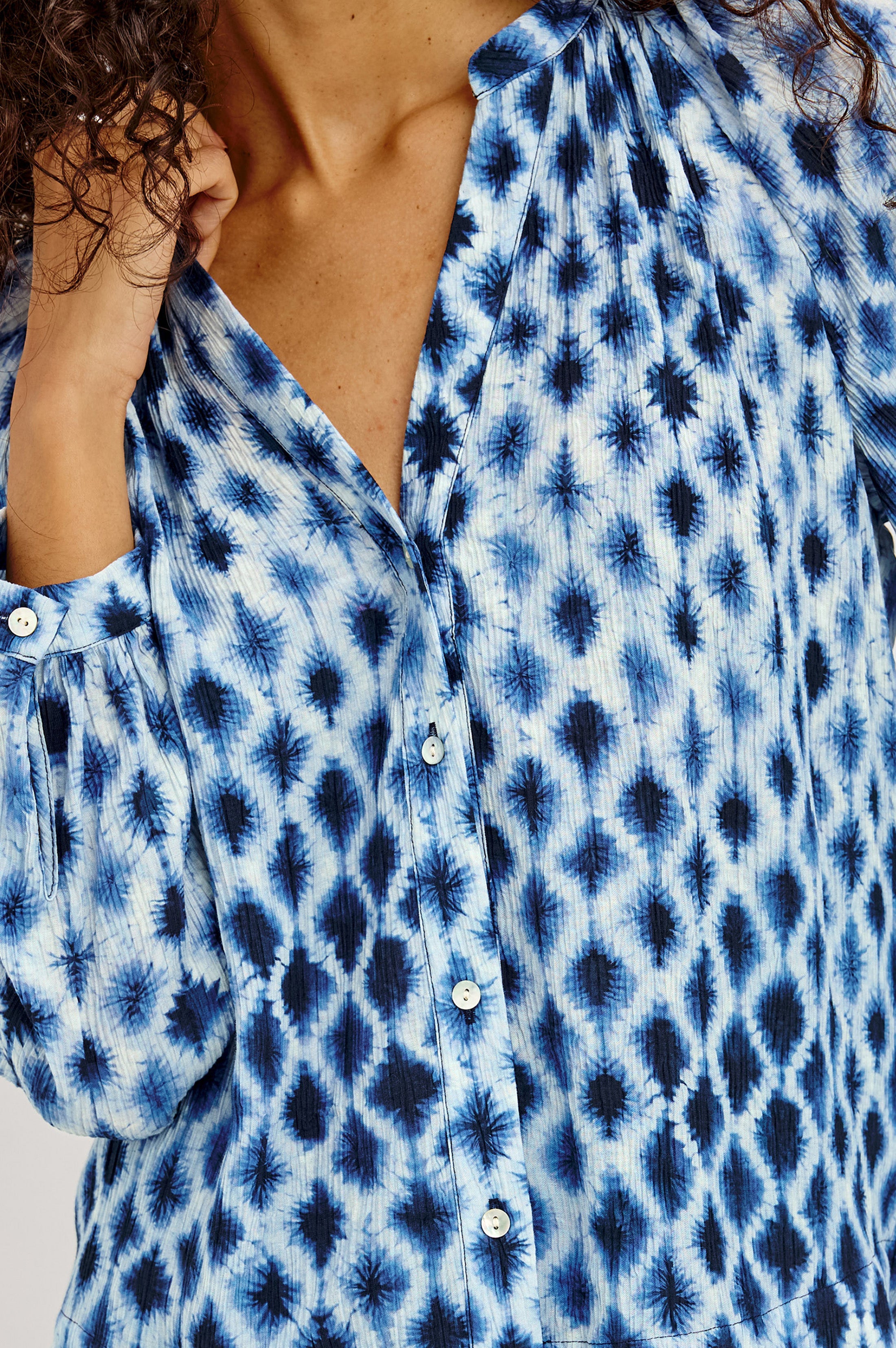 Close-up detail of Rails SAINT blouse in blue and white shibori diamond print pattern