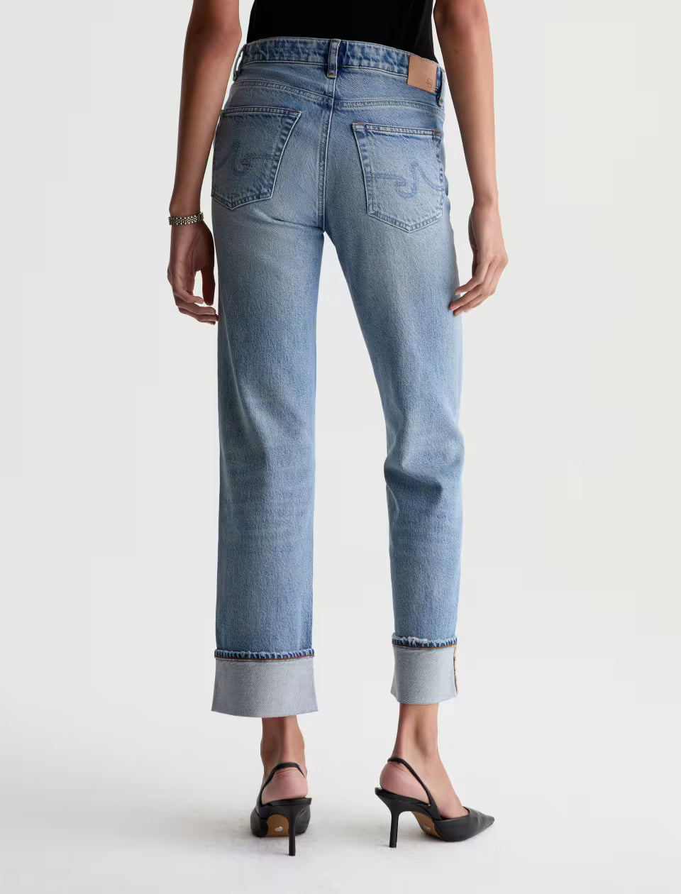 AG Brinley light wash straight-leg jeans with cuffed hem, back view