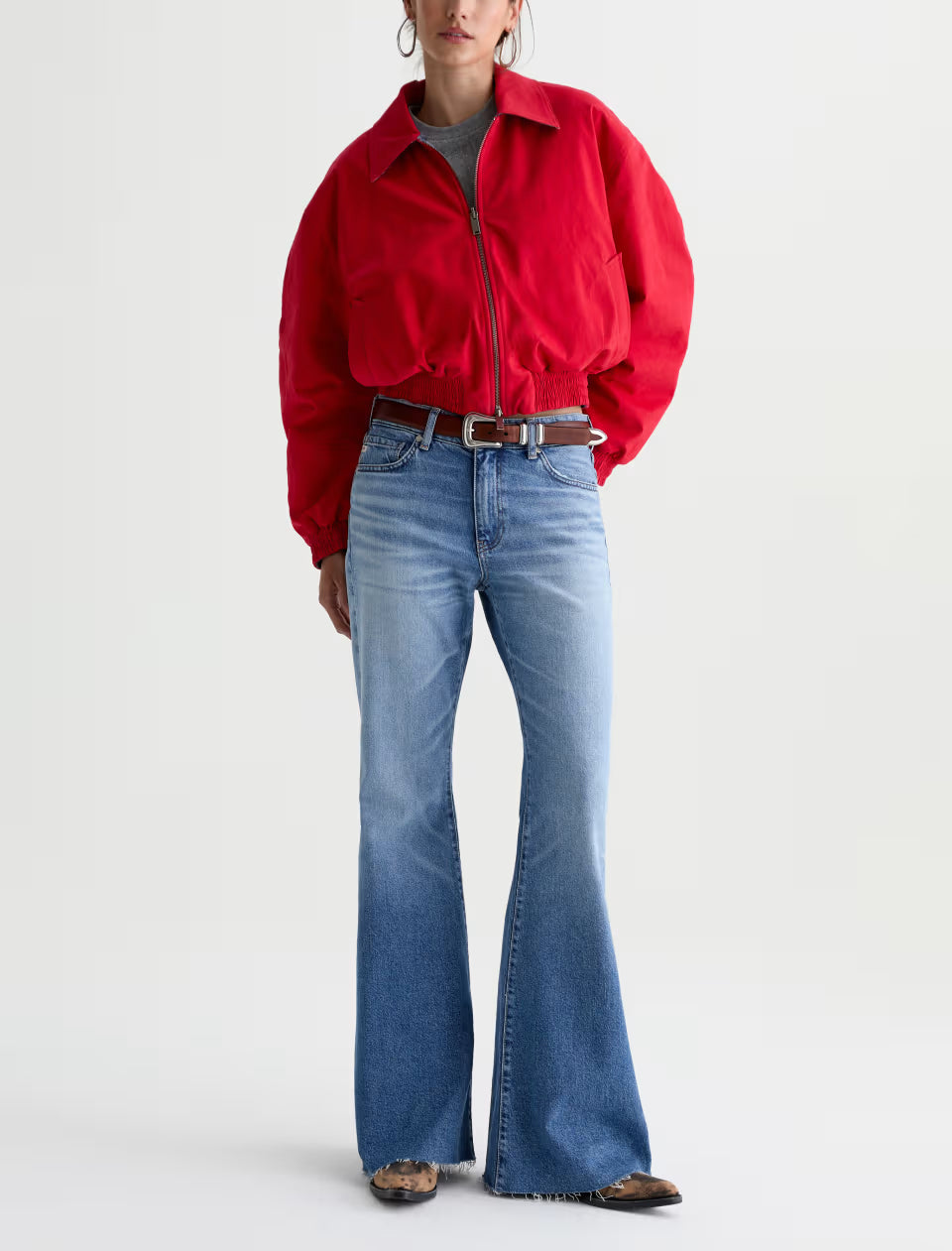AG Georgia flare jeans in medium blue wash with raw-cut hem and belt