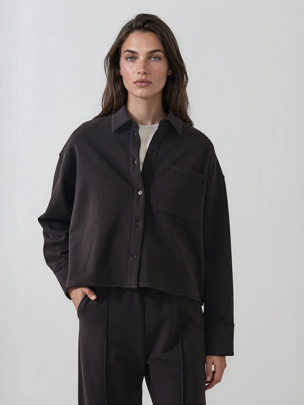 Women's black boxy button-front cropped French terry shirt with chest pocket