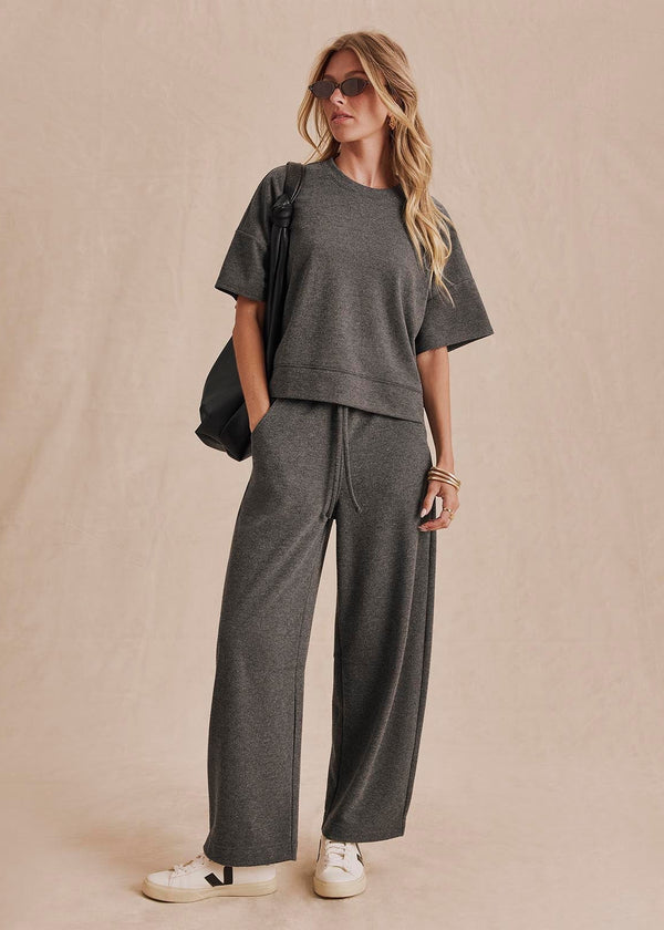 Charcoal gray oversized short sleeve knit top with ribbed hem detail
