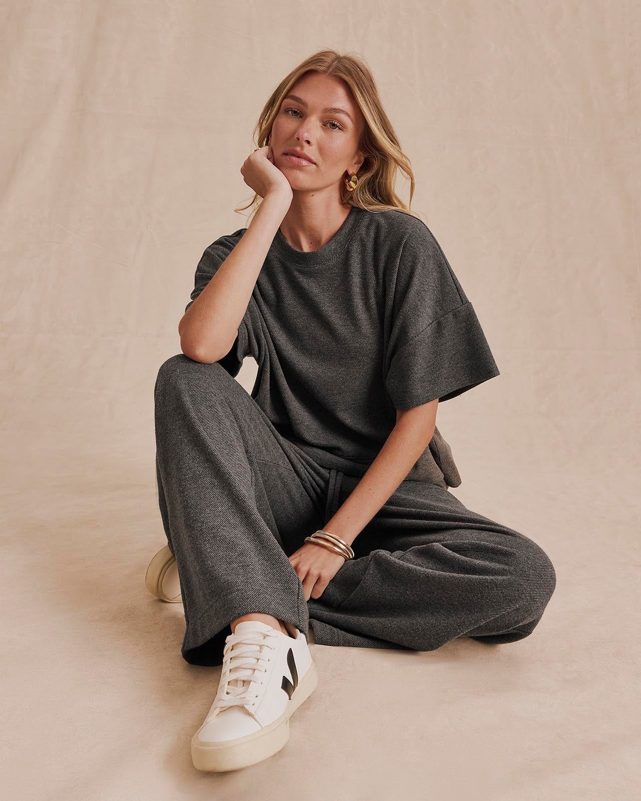 Model wearing Splendid Marlow Tailored Knit short sleeve top in charcoal with matching wide-leg pants
