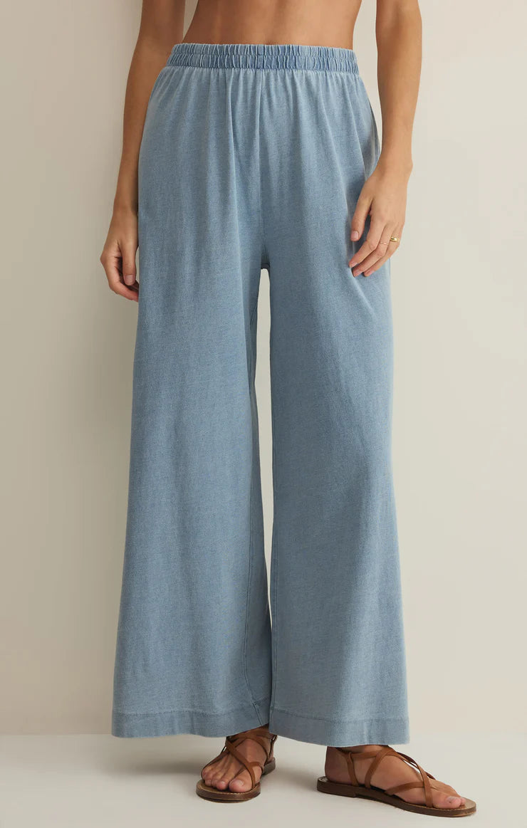 Light blue wide-leg high-rise jersey denim pants with elastic waistband and relaxed fit