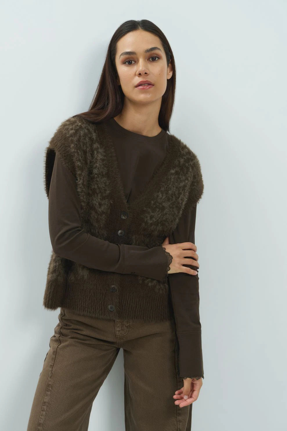 Brown faux fur sleeveless cardigan with button front and ribbed hem