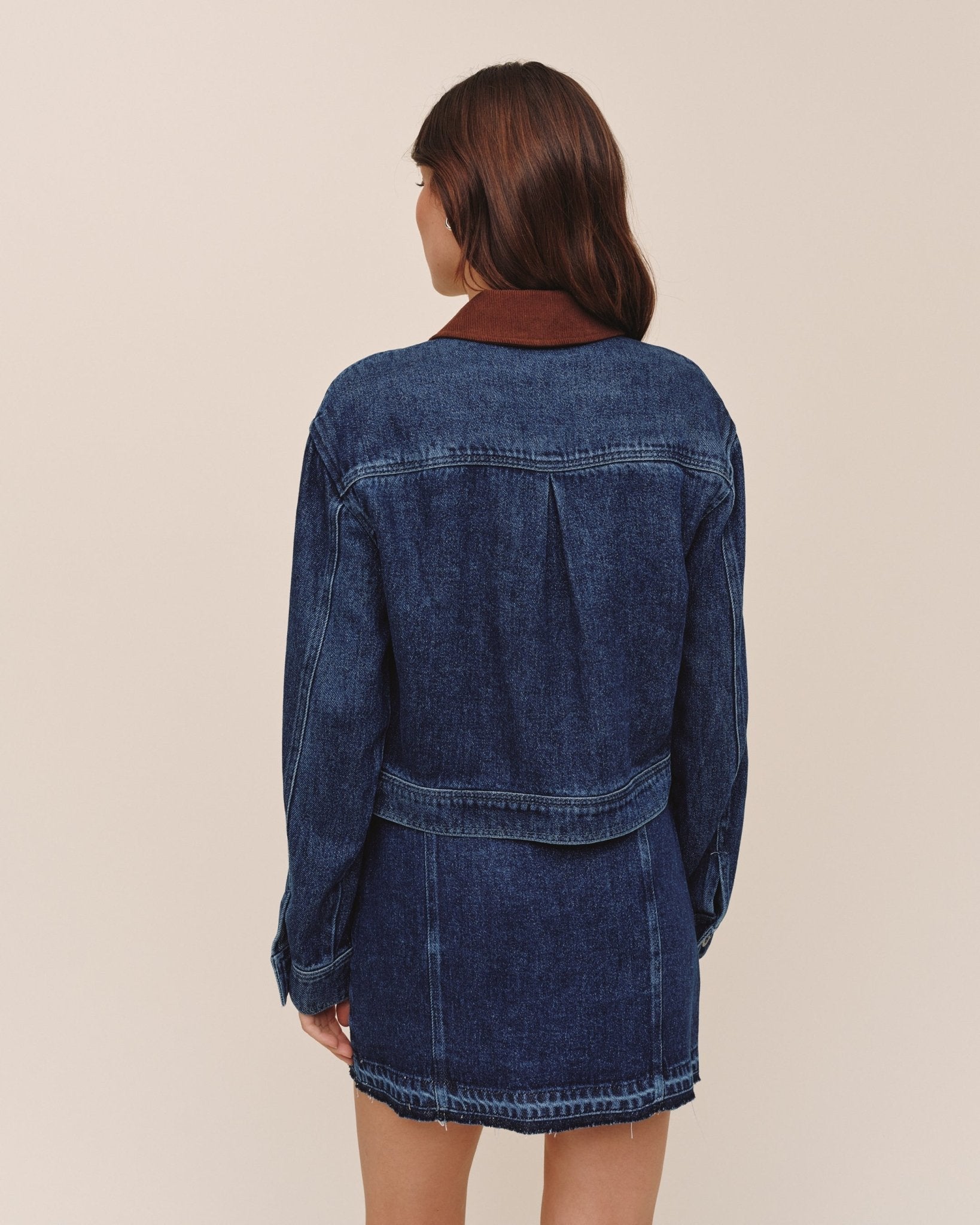 Back view of Bella Dahl Crop Zip Up Barn Jacket in dark rinse wash denim with burgundy collar