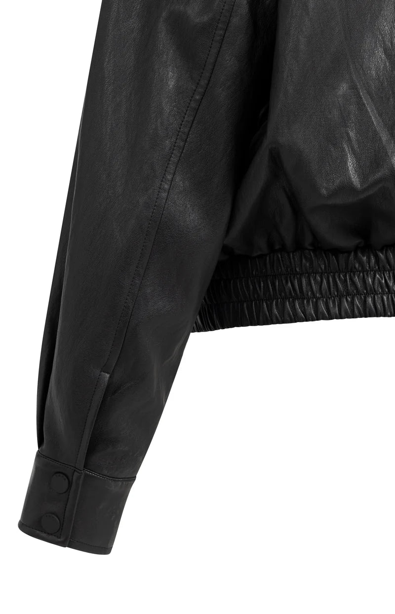 Black faux leather cropped jacket sleeve with elasticated hem and snap button cuff