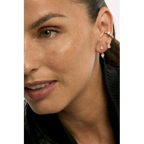 Model wearing gold crystal ear cuff and stud earrings set on ear close-up