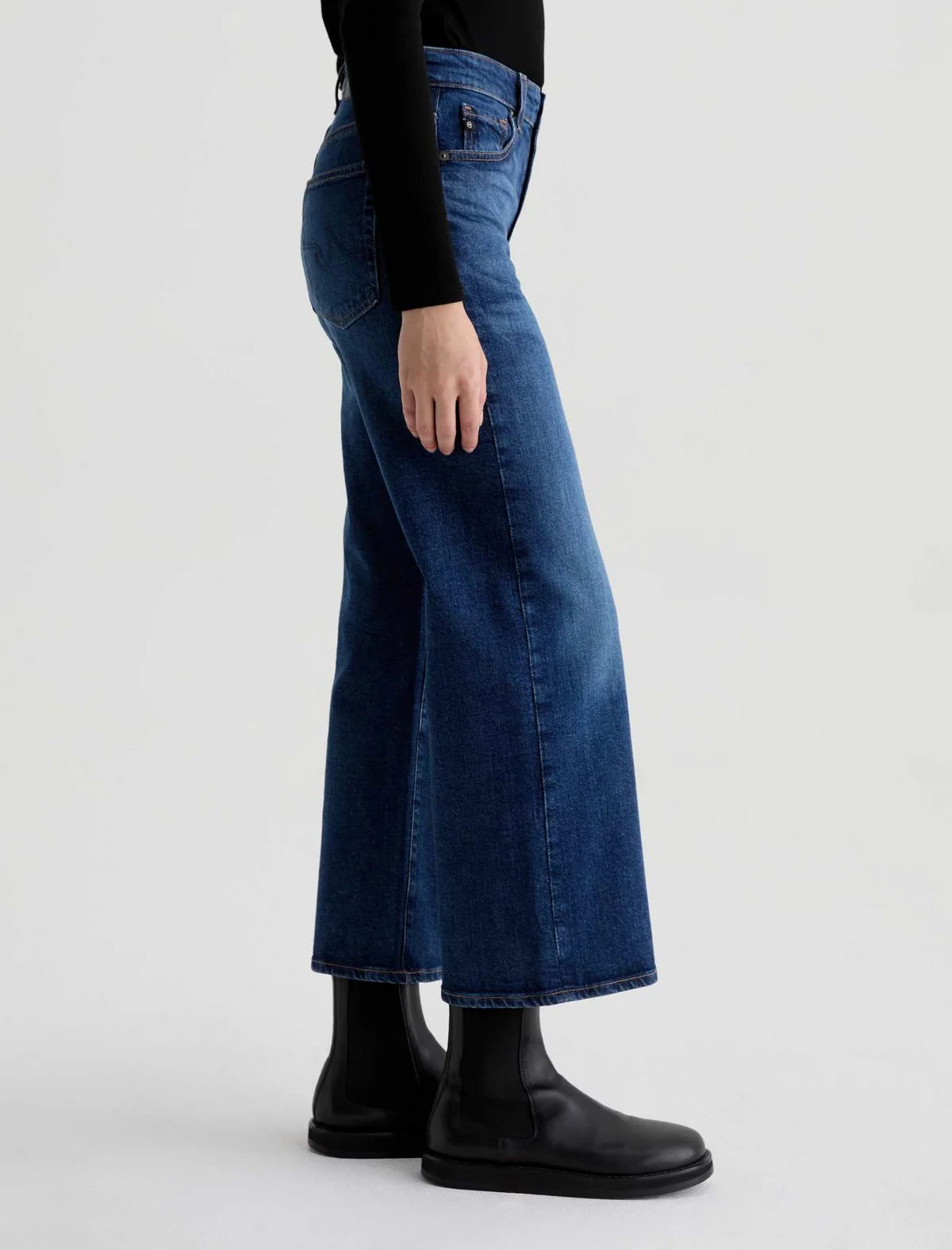 AG Saige wide leg crop jeans in dark blue denim, side view