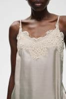 Sage green satin camisole with delicate lace trim neckline and thin straps